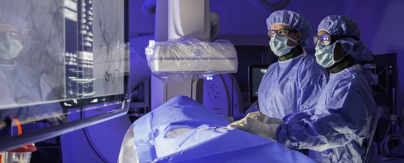 Clinicians reviewing images during an interventional radiology procedure